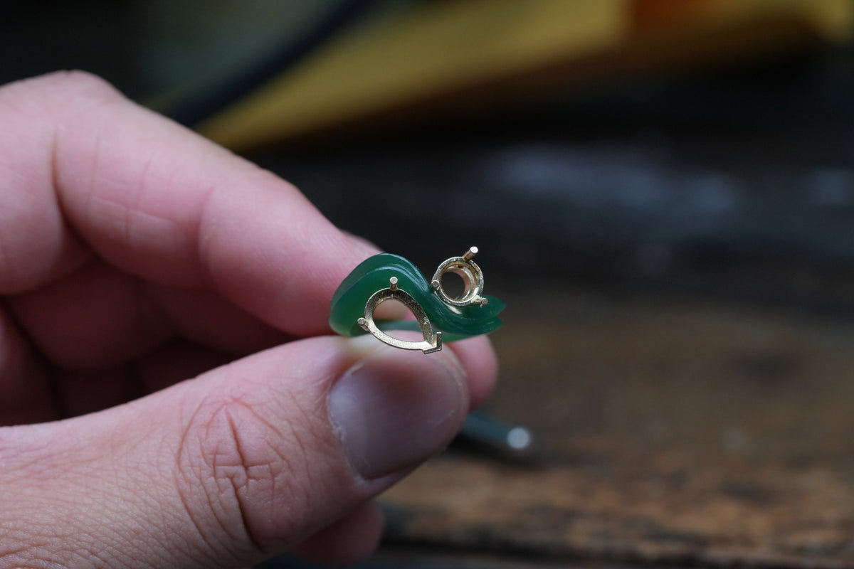 Carved wax model of a toi et moi ring with settings fitted for an heirloom diamond and imperial green jadeite